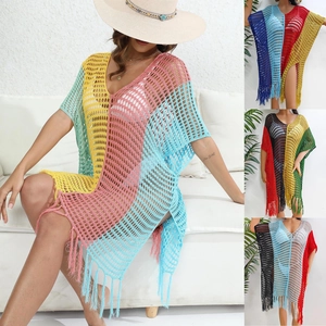 Detail showing multi-color crochet patchwork and long tassel hem of beach cover-up dress