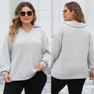 Detail of light grey long-sleeve knit polo top with vertical ribbed texture and V-neck