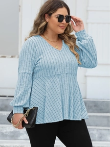 Women's plus size light blue V-neck top with puff sleeves and textured ribbed knit fabric
