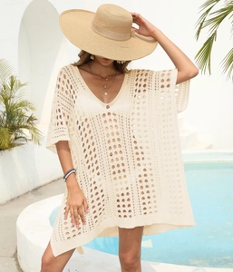 Detailed close-up of bohemian crochet beach cover-up featuring hollow-out circular patterns