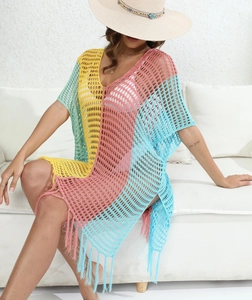 Detail of color-block crochet beach cover-up with hollow knit and fringe hemline