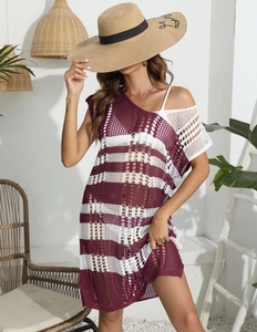 Detail of burgundy and white striped crochet knit pattern on a beach cover-up dress