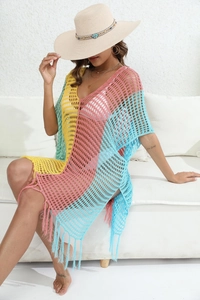 Detailed close-up of multicolor crochet beach cover-up with knit hollow patterns and fringe