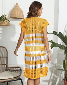 Detail of the yellow and white striped crochet knit pattern on the beach cover-up