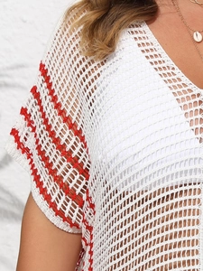 Close-up detail of white crochet knit beach cover-up with red striped sleeve cuffs