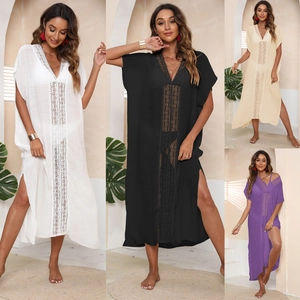 Detailed lace patchwork and semi-transparent fabric texture of the V-neck beach cover-up