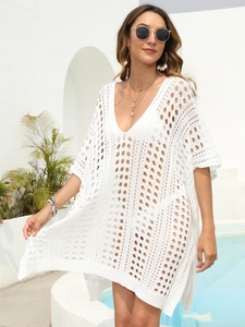 Detailed crochet texture and V-neckline on this white hollow knit beach cover-up dress