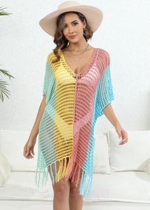 Close-up of colorful crochet knit beach cover-up with tassel hem and hollow-out detail