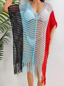 Detail of V-neck crochet beach cover-up featuring colorful striped panels and fringe hem