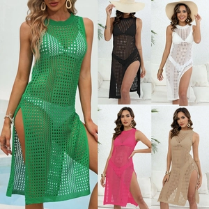 Detail of crochet knit beach cover-up featuring hollow mesh texture and side split hem