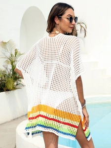 Rear view of white crochet beach cover-up with vibrant rainbow stripes at the hem