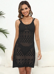 Detailed knit pattern on a black geometric hollow-out beach dress with thin straps