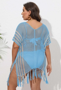 Detail of light blue plus size crochet beach cover up with orange stripes and side tassels