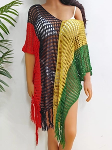 Detail of multi-color crochet beach cover-up featuring fringe trim and knit texture