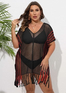 Detail of plus size crochet beach cover up with red stripes and fringe tassels