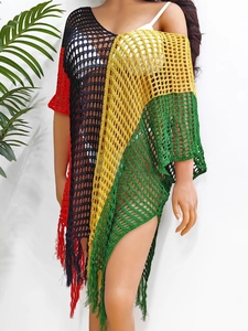 Detail view of crochet beach cover-up with color-block knit pattern and fringe hem