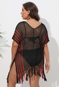 Detail view of black crochet beach cover-up with red stripe accents and fringe hem