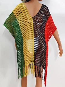 Detail of crochet knit beach cover-up with multi-color stripes and fringe hem