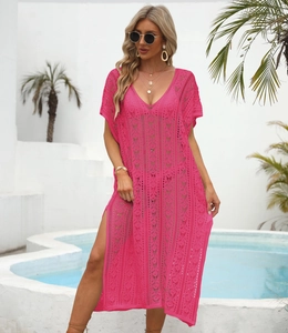 Detail of rose red crochet beach cover up featuring intricate geometric lace patterns