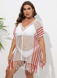 Detail of white V-neck crochet beach cover-up with red vertical stripes and fringe hem