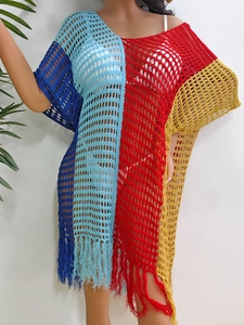 Women's crochet beach cover-up dress featuring colorful patchwork and fringe tassels
