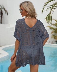 Close-up of the intricate diamond crochet pattern on the charcoal beach cover-up