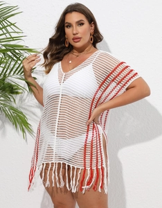 Detail of white crochet beach cover-up with red stripes, deep V-neck and side slits