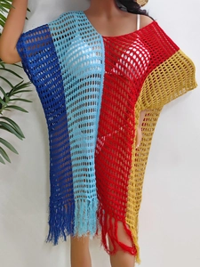 Close-up of color block crochet hollow-out dress with decorative fringe details