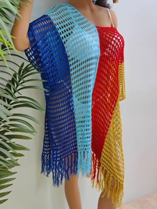 Detail view of colorful crochet knit cover-up with color-block mesh and fringe trim