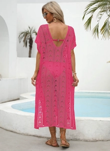 Detail of rose red hollow knit beach cover-up showing geometric crochet patterns