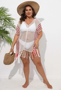 Detail of plus size striped knit beach cover-up with white and red fringe tassels
