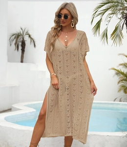 Detail view of the deep V-neck and intricate crochet knit texture of the beach cover-up