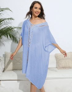 Detail of light blue beach cover-up with crochet lace V-neck and drawstring waist
