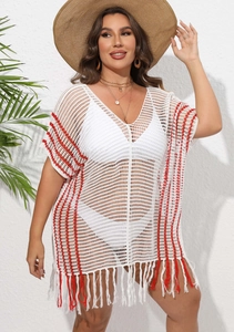 Detail of white crochet beach cover-up featuring red stripes and long fringe tassels