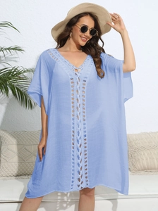 Detailed view of the light blue crochet lace neckline on this loose beach cover-up dress