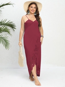 Close-up of wine red plus size dress with intricate laser-cut floral hollow-out hem