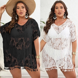 Detailed close-up of plus size lace crochet beach cover-ups with tassels and deep V-neck