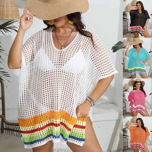 Close-up of knit hollow V-neck beach cover-up with vibrant rainbow striped hem detail