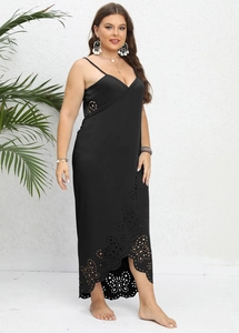 Close-up of laser-cut hollow patterns on black plus size maxi dress with deep V-neck