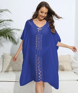 Close-up of royal blue V-neck kaftan dress featuring intricate crochet detailing