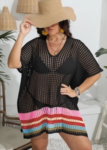 Detail of black crochet beach cover-up with V-neck and colorful striped hem
