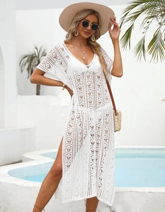 Detailed view of white crochet beach cover-up with high side slits and boho style