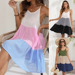Detail of V-neck color block maxi dress with adjustable tie shoulder straps and layered fabric