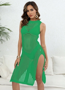Close-up of green hollow-out knit dress with side slit and round neck for beach wear