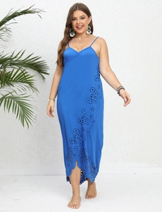 Detail of royal blue wrap dress showing laser-cut floral patterns and thin straps