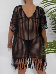 Back view of black crochet beach cover-up with ethnic tassels and colorful trim details