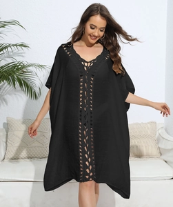 Close-up of black crochet hollow-out design on a loose V-neck beach kaftan cover-up