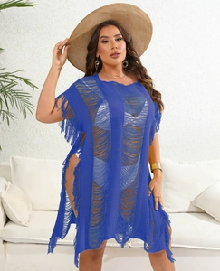 Macro detail of navy knit beach cover-up with hollow weave, side slits and long fringe