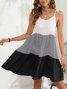 Detail of color-block tiered sun dress with V-neck and delicate spaghetti straps