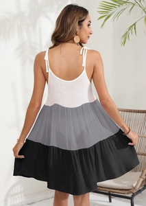 Detailed back view of a tricolor striped sundress with delicate straps and open back